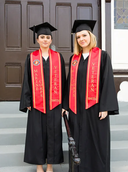 a man and woman wearing graduation gowns and caps