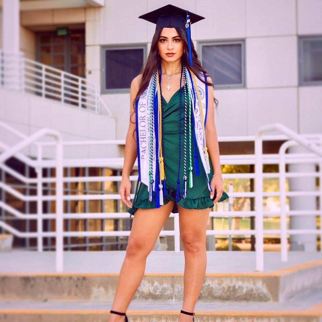 Female graduate striking a pose for her graduation photo