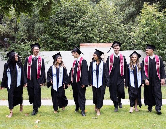 graduating seniors with custom stoles for graduation